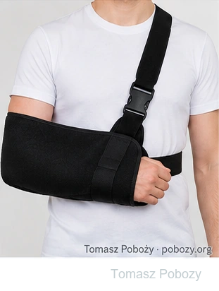 Postoperative rehabilitation: Arm supported in a sling after shoulder surgery. Prepared by Tomasz Poboży — orthopaedic surgeon.